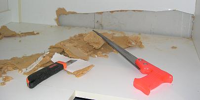 Damaged Portion of Kitchen Cabinet MDF-Melamine Removed with Skill Saw and Box Cutter