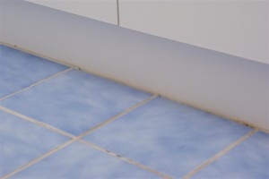 Cracked and Damaged Grout Against Vanity
