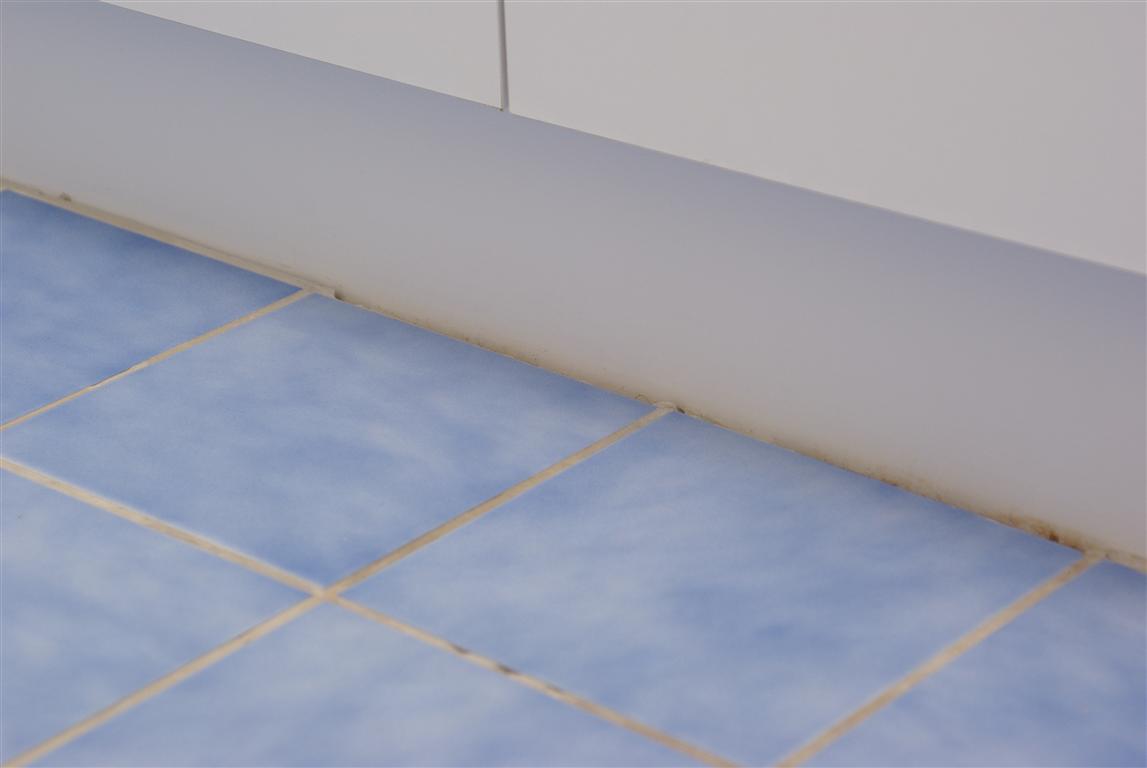 Should You Tile Under Bathroom Vanities Or Kitchen Cabinets