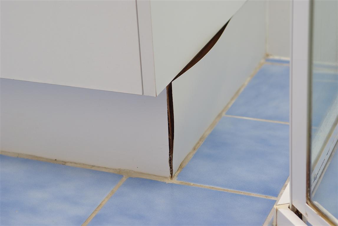 Should You Tile Under Bathroom Vanities Or Kitchen Cabinets